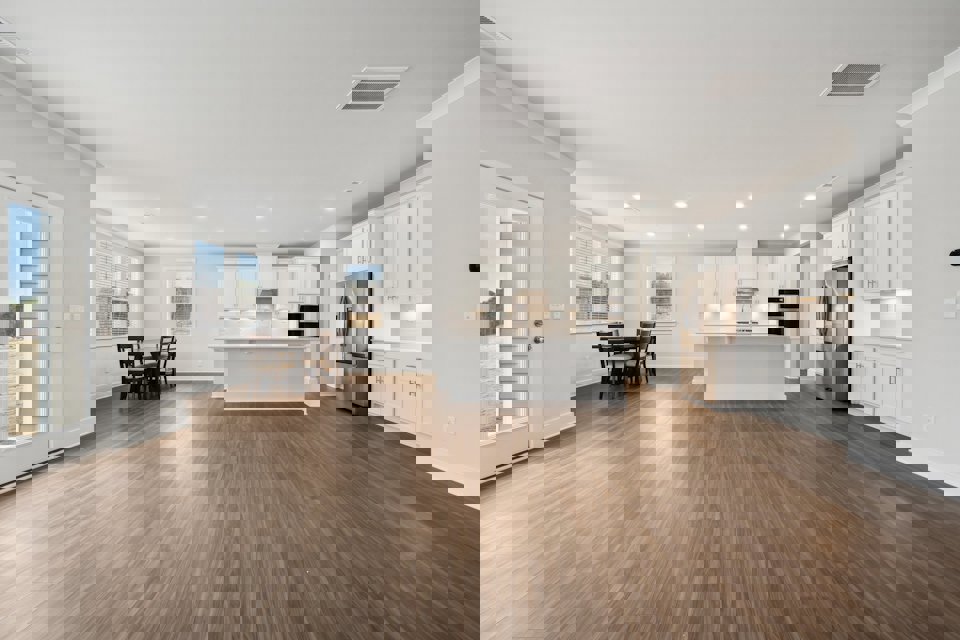 A large kitchen with white cabinets.