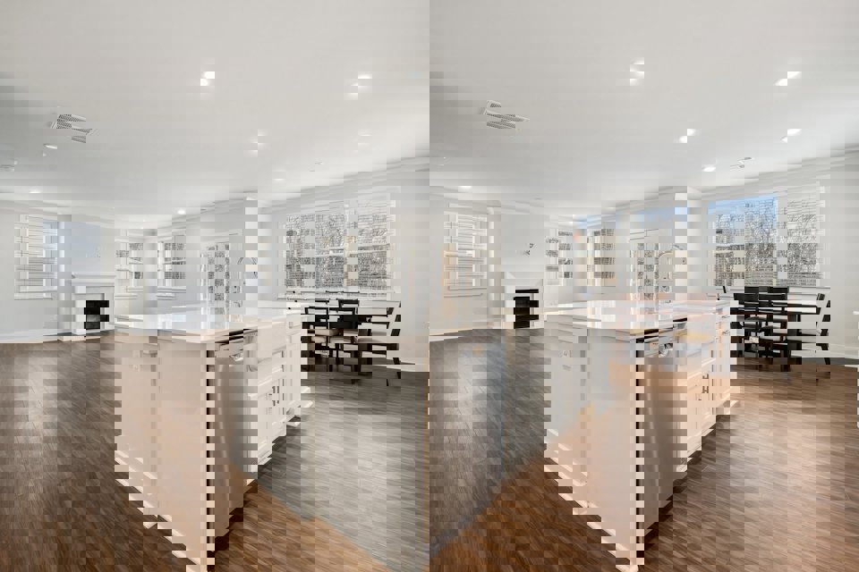 A large kitchen with white cabinets.