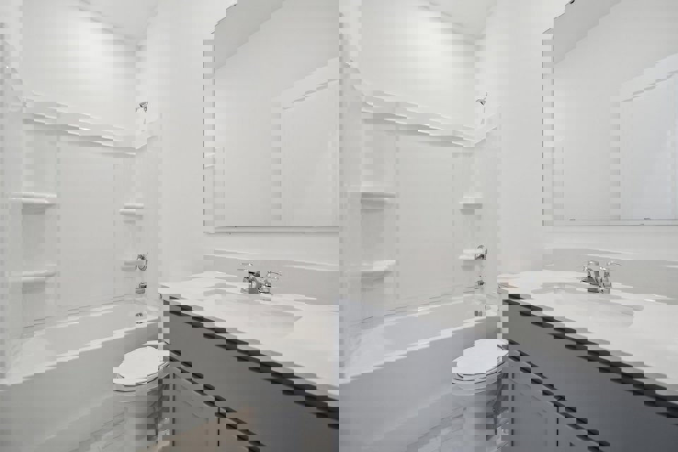 A bathroom with a sink toilet and bathtub.