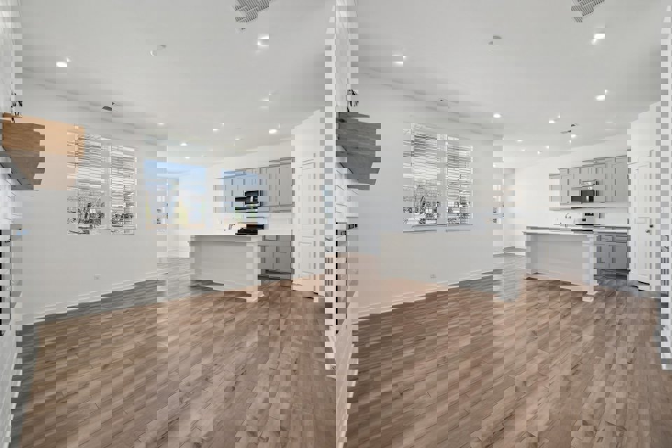 A large kitchen with white cabinets.