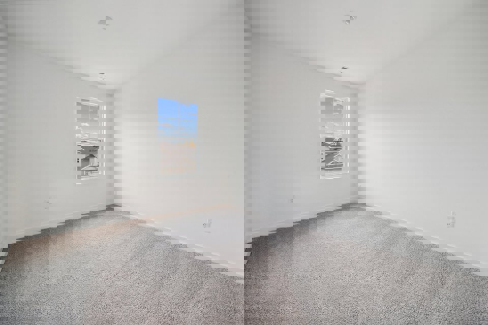 A room with a window and a shelf with a window.