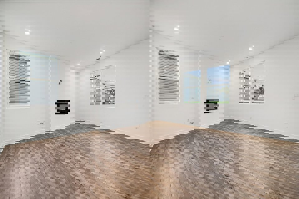 A room with a wood floor and a wood floor.