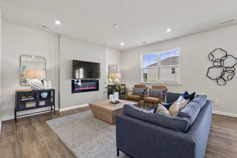 A living room with a couch and a tv.
