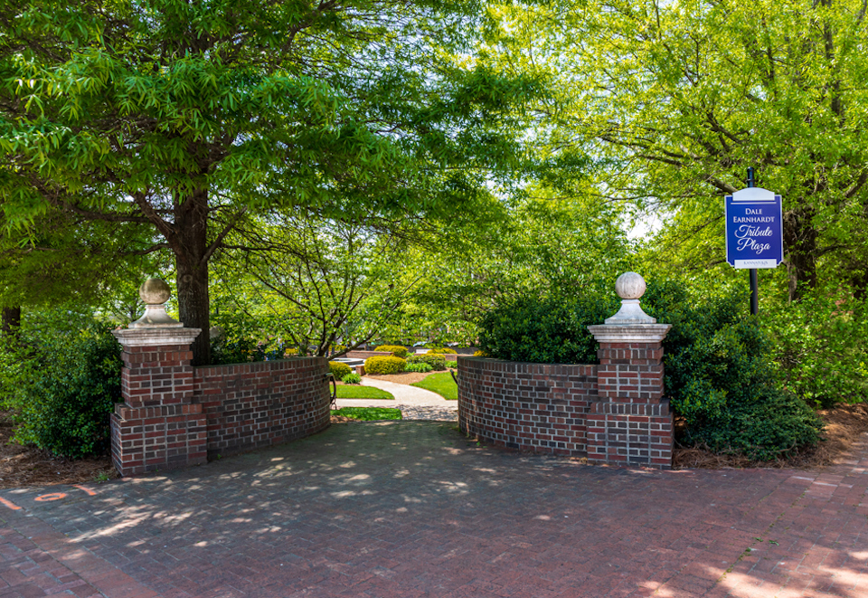 A brick wall with a sign on it.