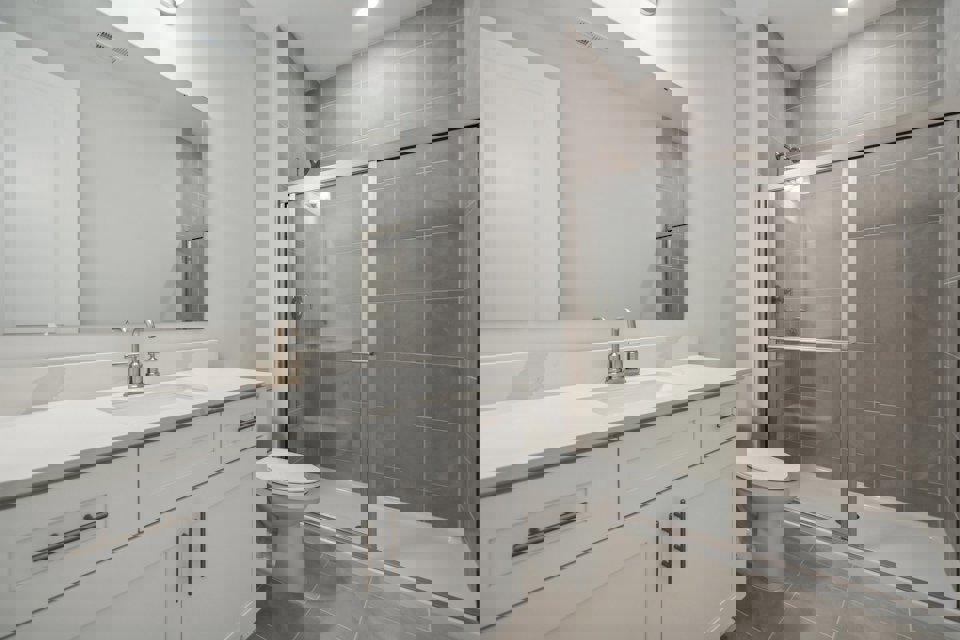 A bathroom with a glass shower.