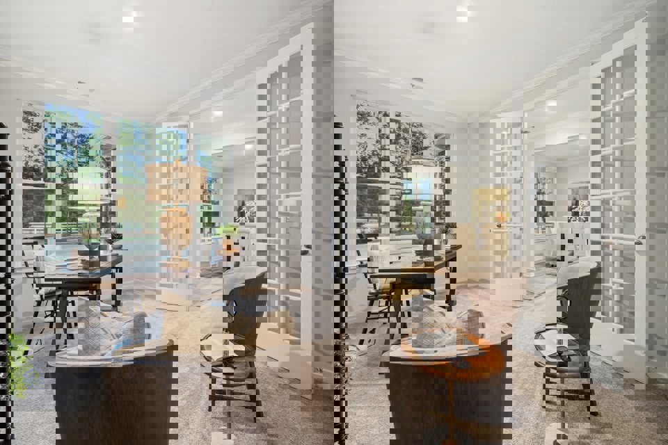 A living room with a large glass door.