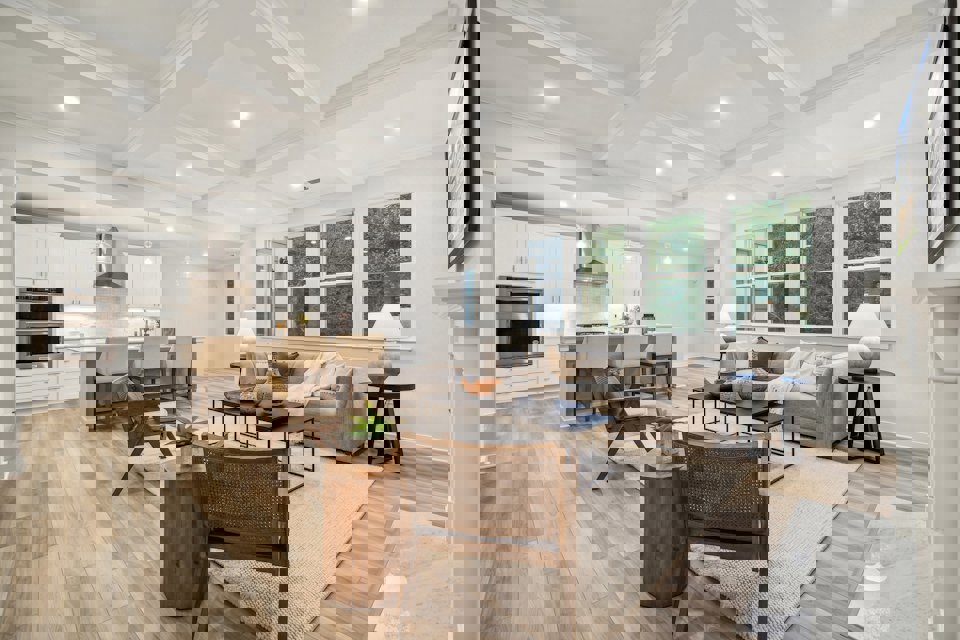 A large living room with a wood floor and a wood floor.