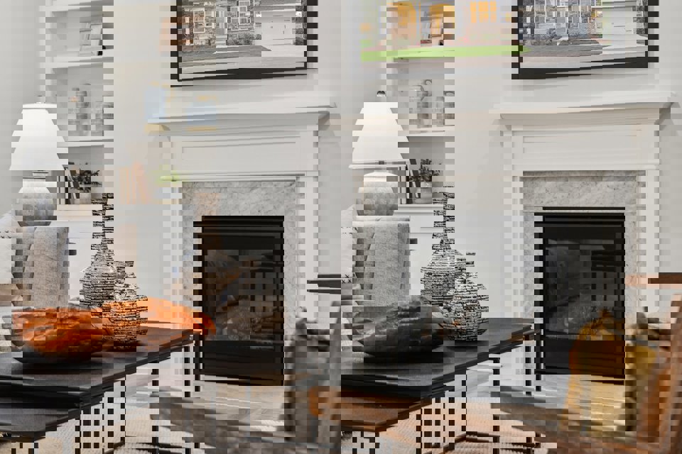 A living room with a fireplace.