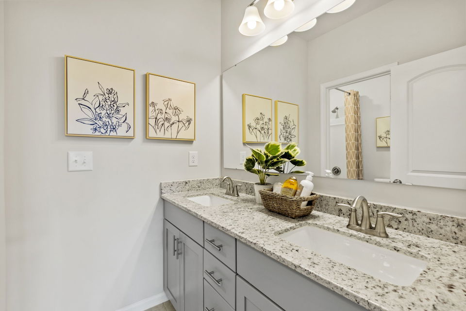 A bathroom with a large mirror.