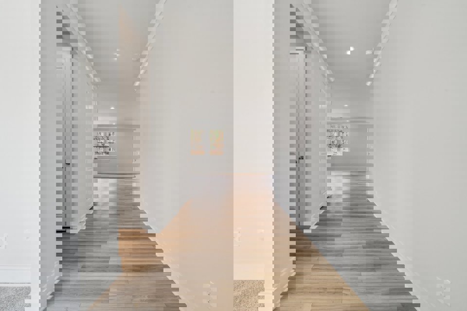 A hallway with white walls.