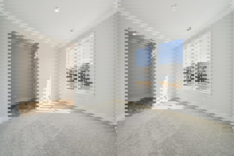 A room with a window and a door.