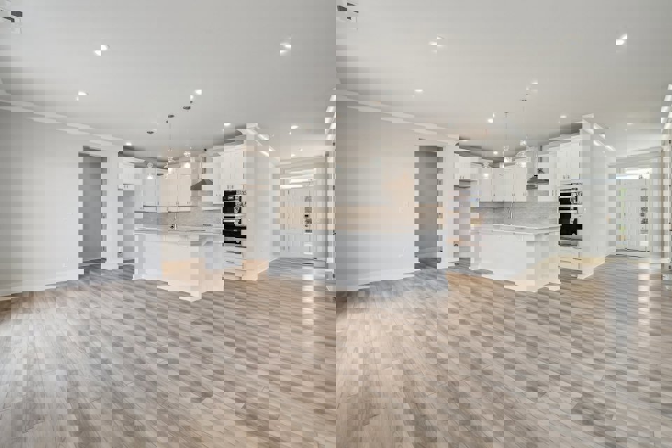 A large kitchen with white cabinets.