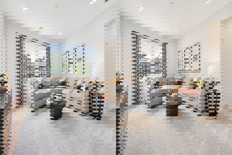 A living room with a couch and a coffee table.