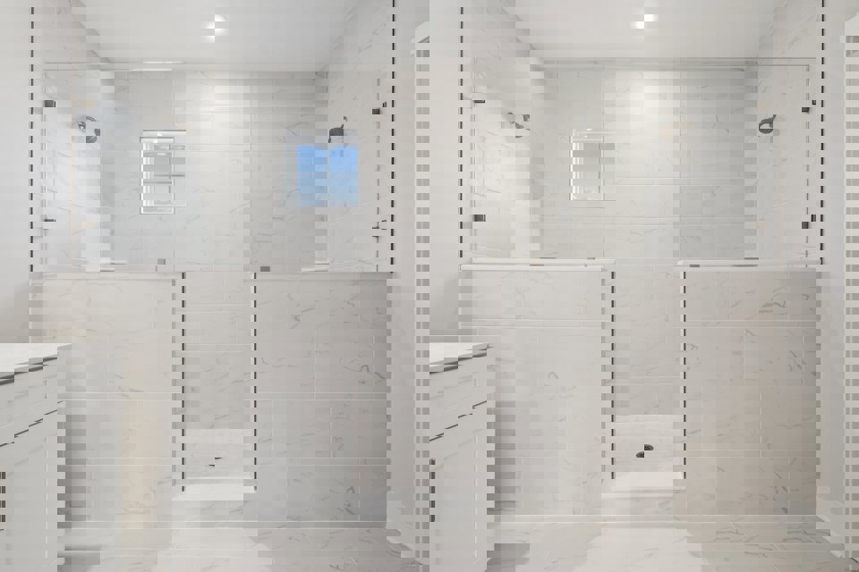 A bathroom with a tile floor.