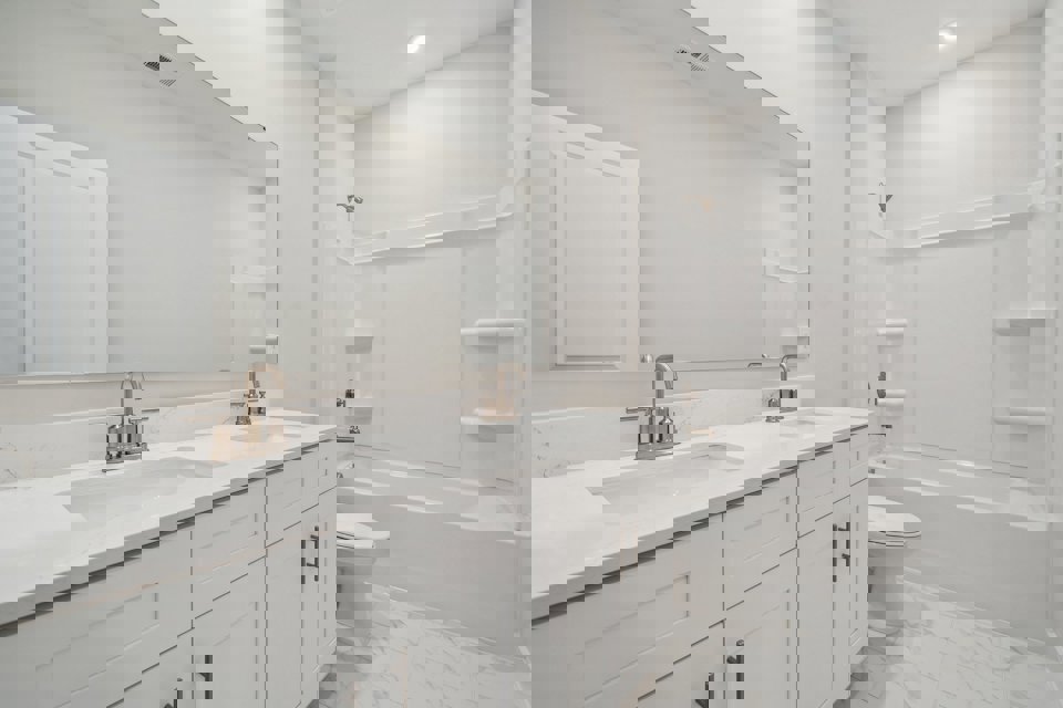 A bathroom with a tub sink and toilet.