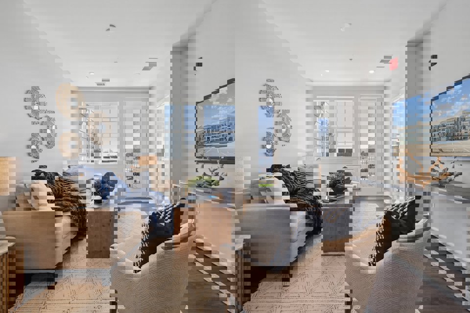 A living room with a couch and a table.