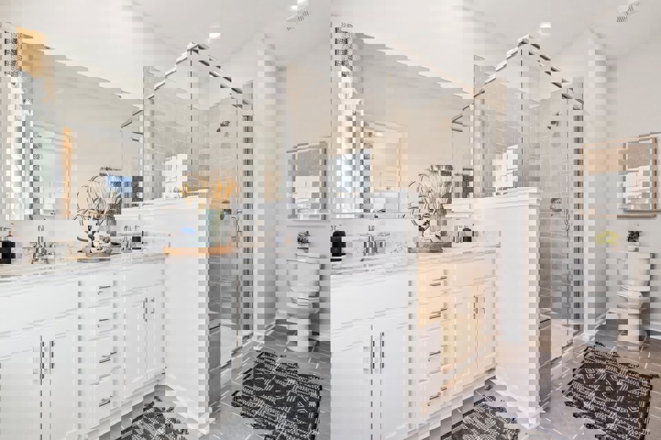 A bathroom with a glass shower.