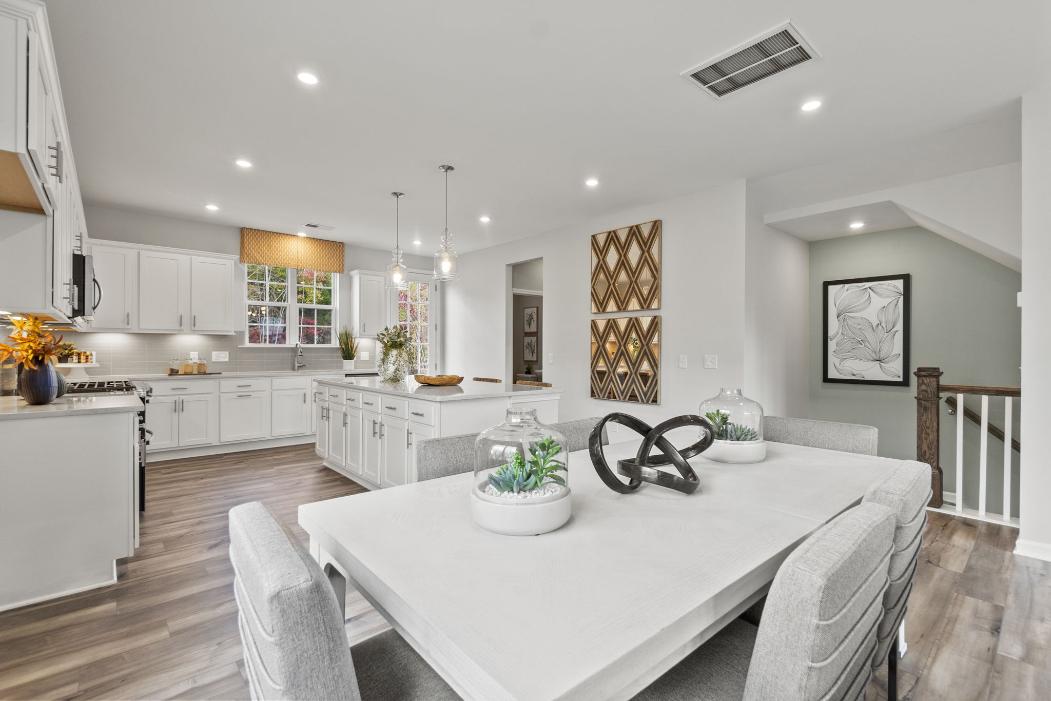 A kitchen with a dining table.
