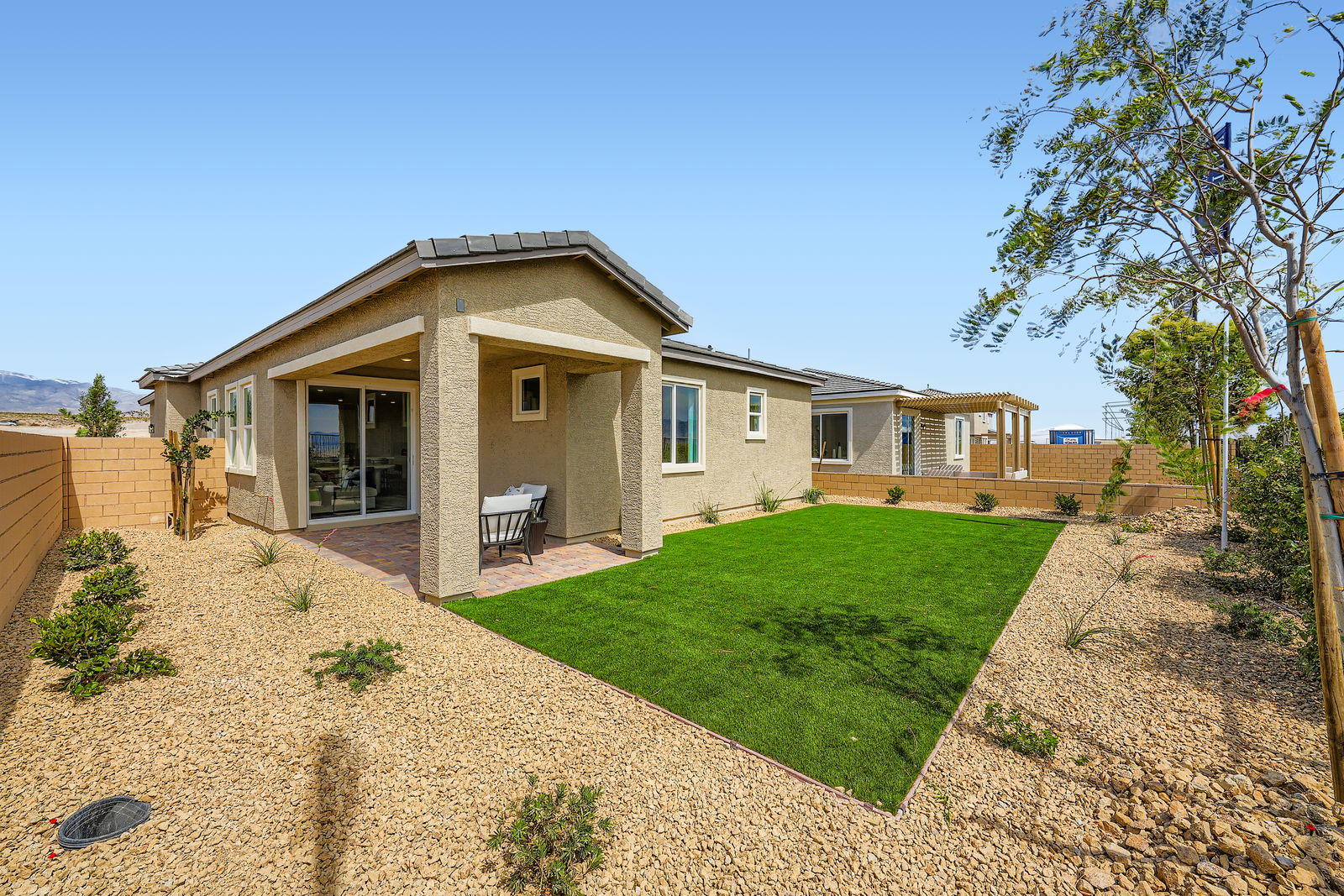 A house with a large front yard.