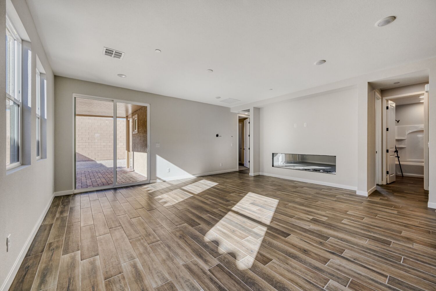 A room with a wood floor and a wood floor.