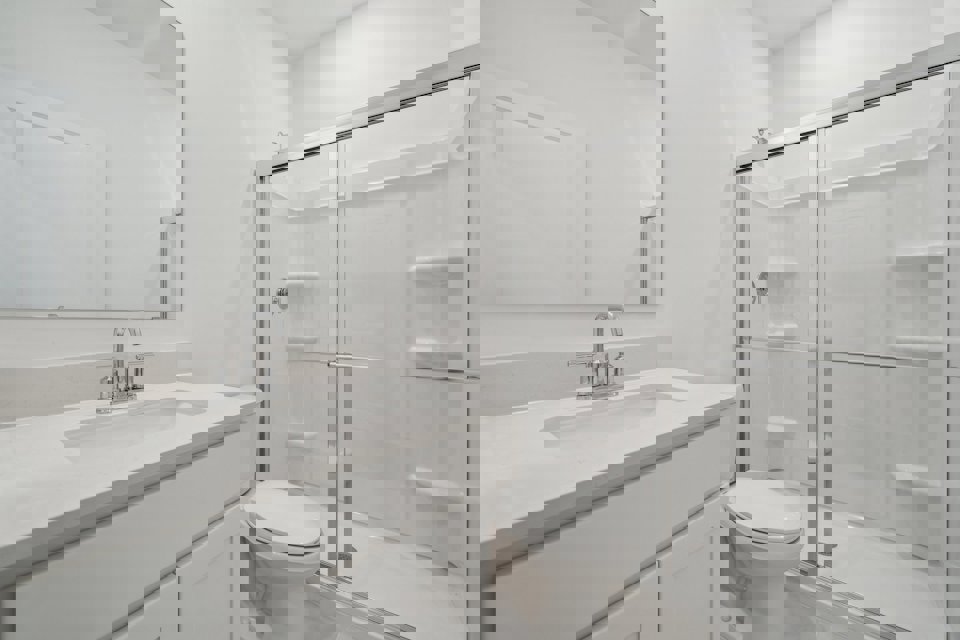 A bathroom with a glass shower.