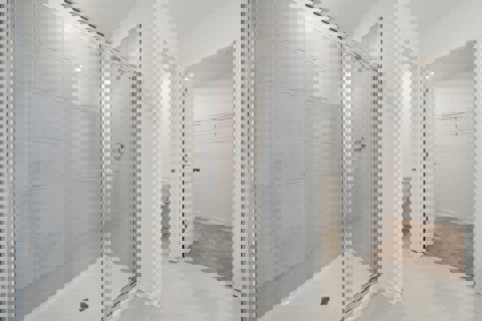 A bathroom with a glass shower.