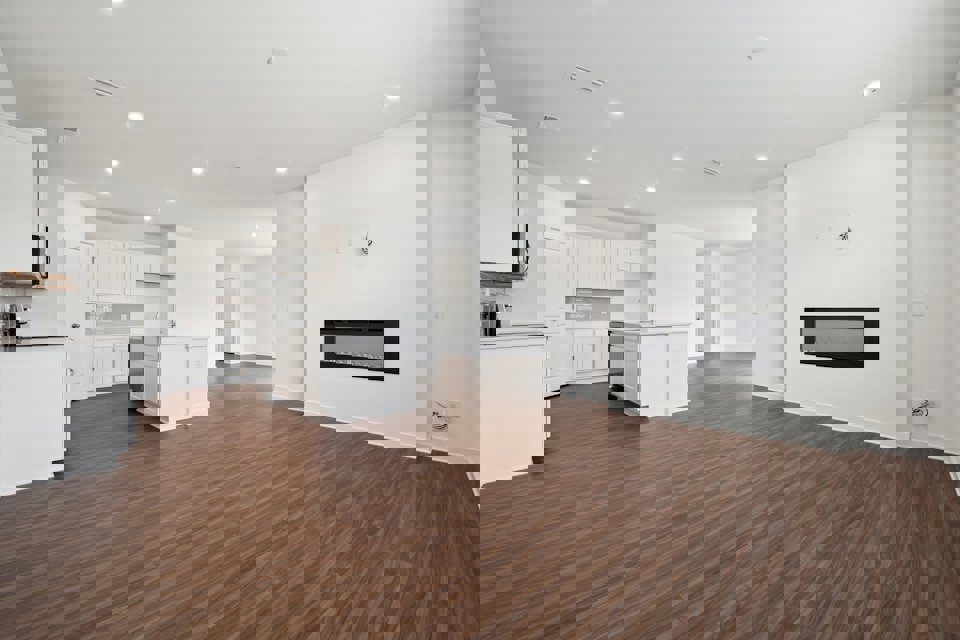 A large kitchen with white cabinets.