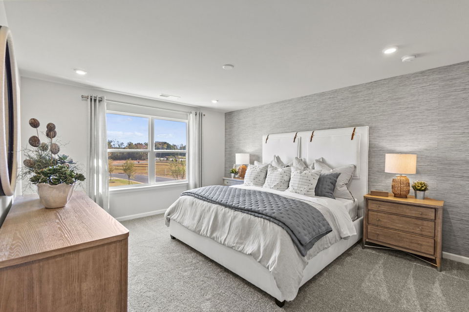 A bedroom with a large bed.