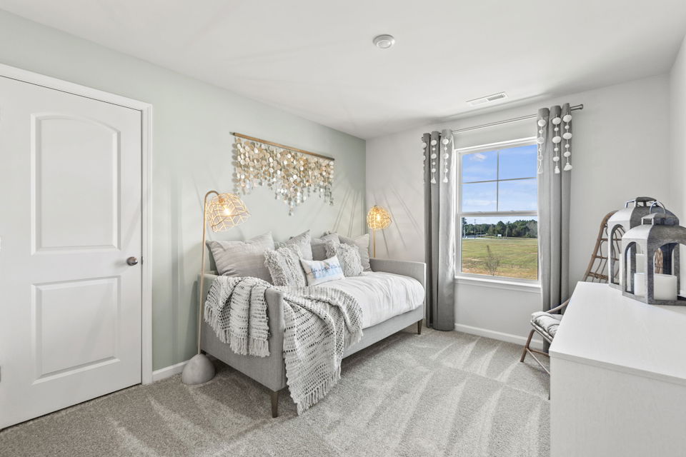 A bedroom with a large bed.