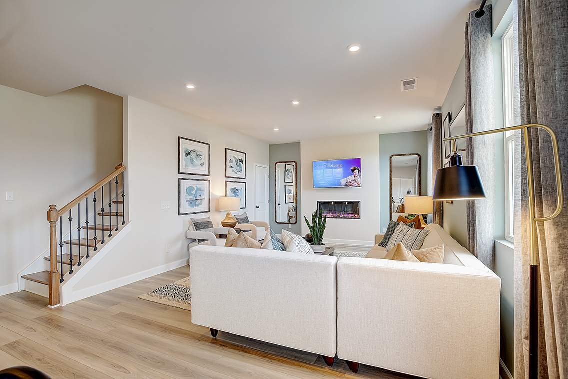 A living room with a white couch.
