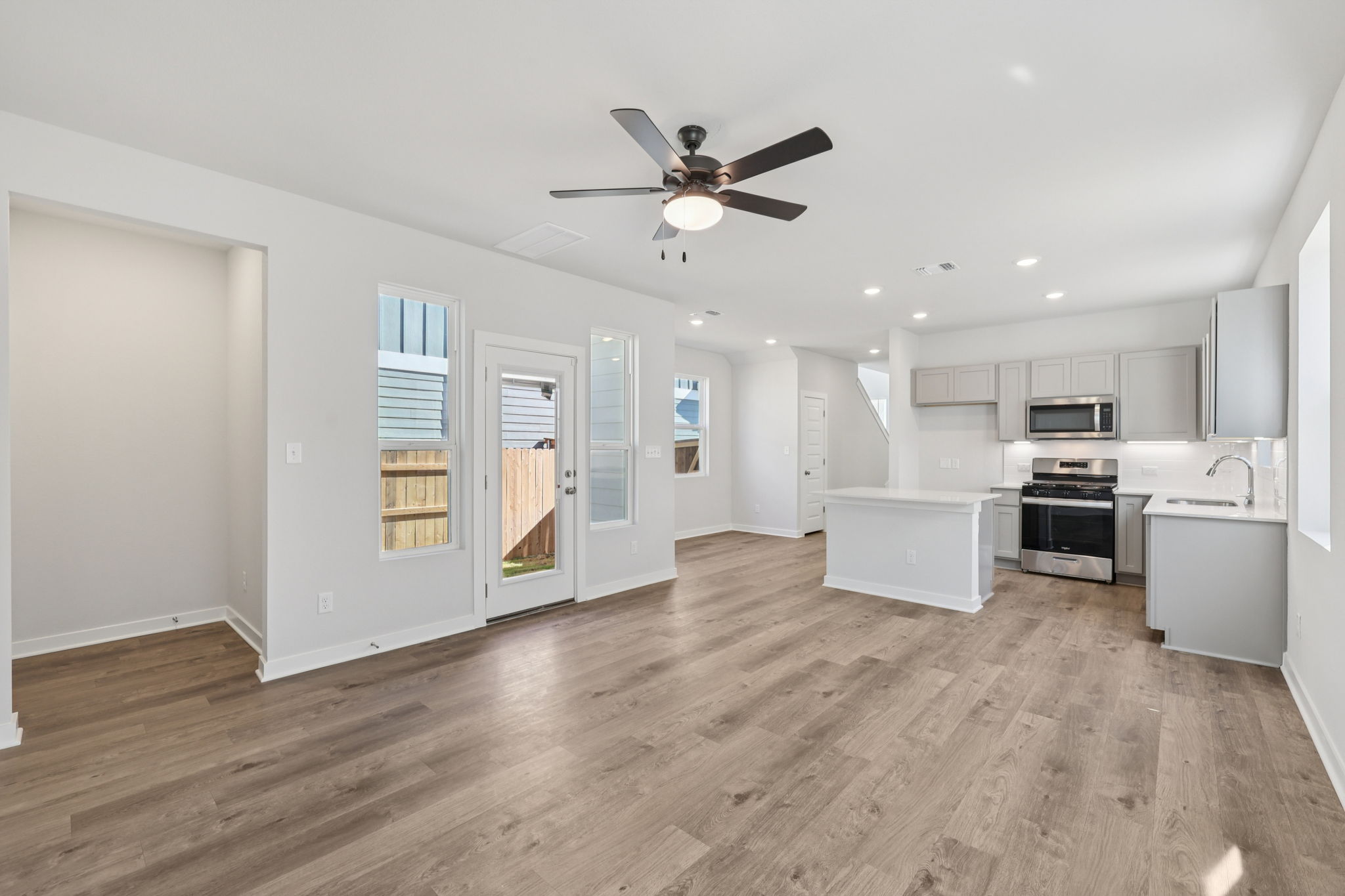 A large kitchen with white cabinets.