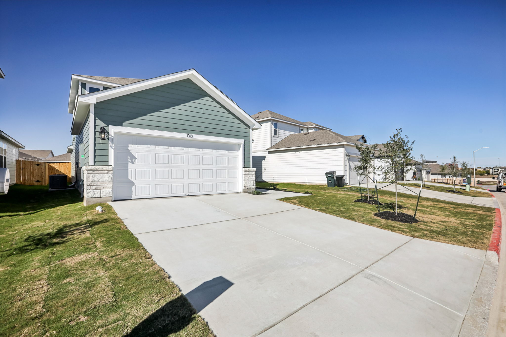 A driveway leading to a house.