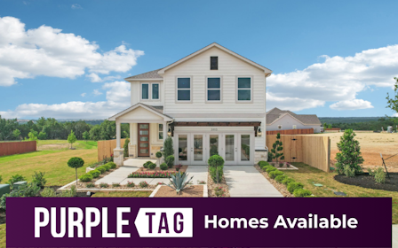 A house with a fence and trees.