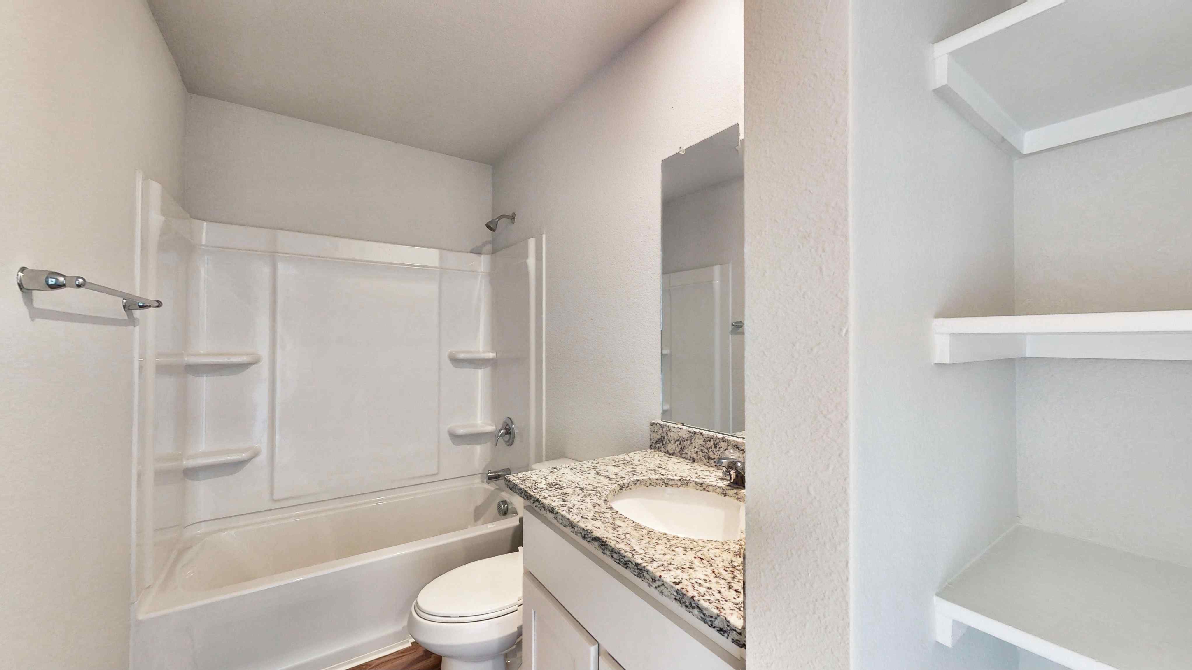 A bathroom with a sink and a bathtub.