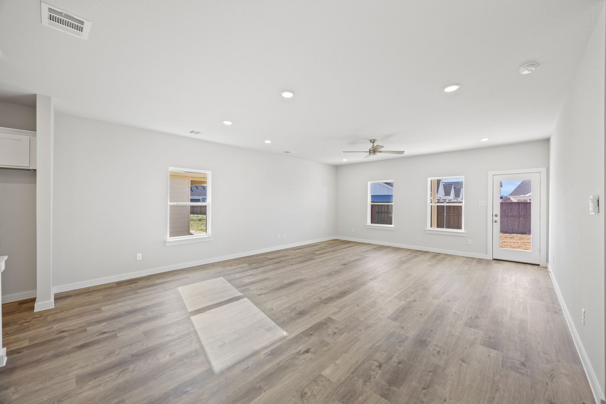 A room with a wood floor and a wood floor.