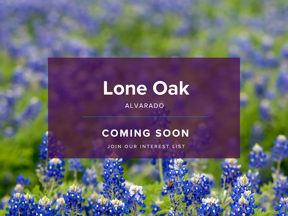 A sign in a field of flowers.