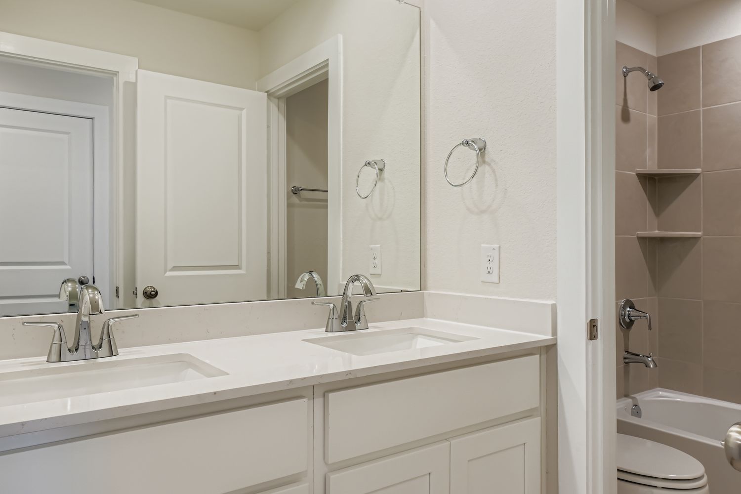 A bathroom with a sink and a toilet.