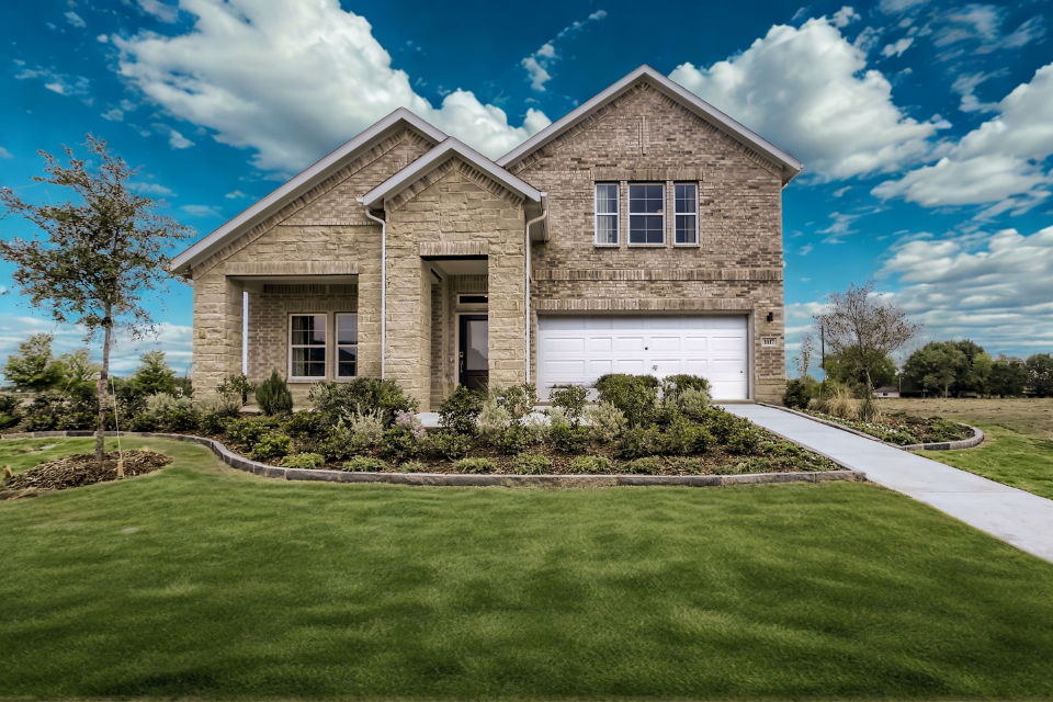 A house with a large front yard.