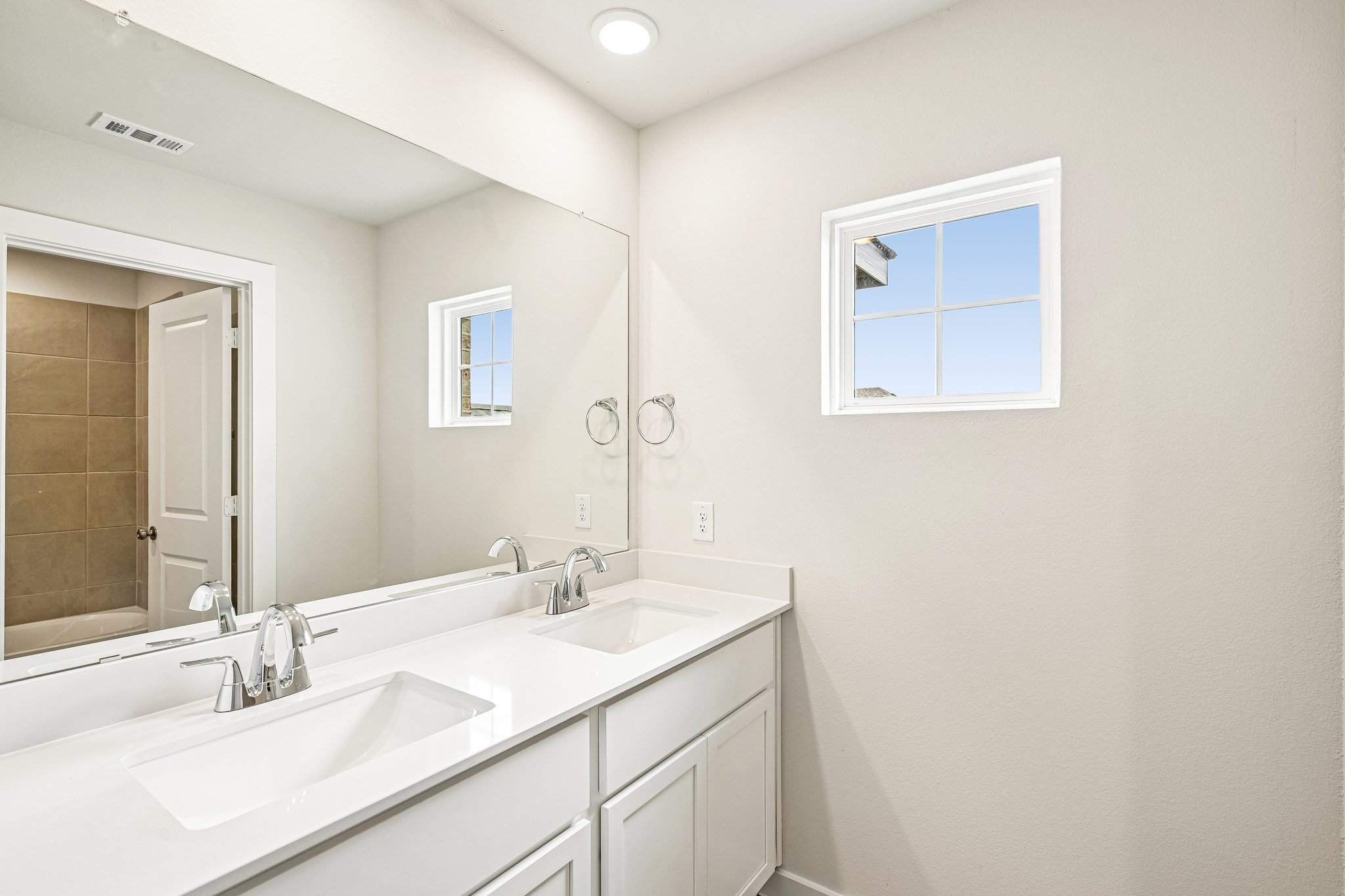 A bathroom with two sinks.