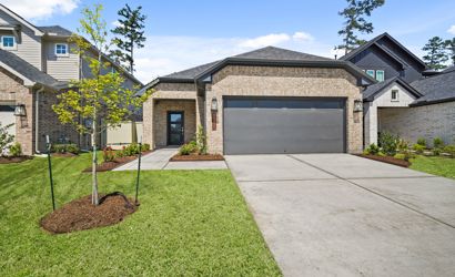 A driveway leading to a house.