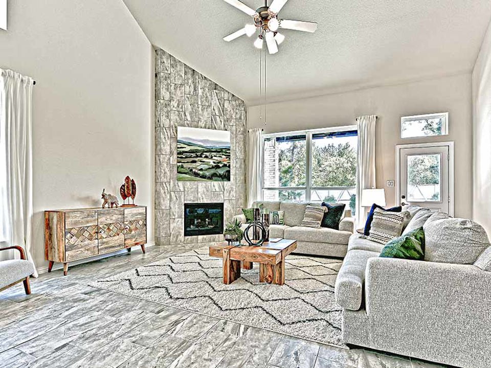 A living room with a fireplace.