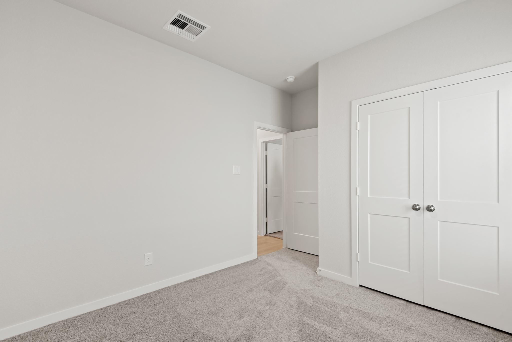 A room with white doors.