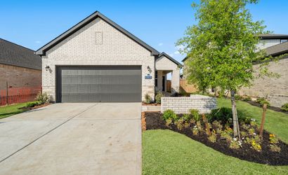 A driveway leading to a building.