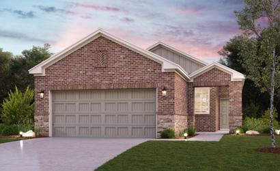 A brick house with a driveway.