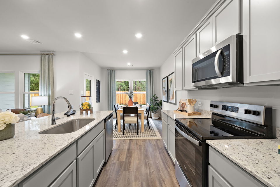 A kitchen with black appliances.