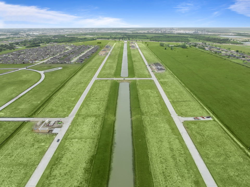 A road with grass and trees.
