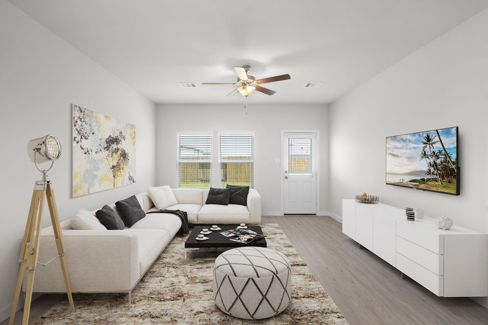 A living room with a couch and a table.