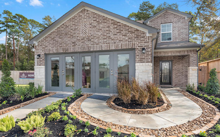 A building with a fountain in front.