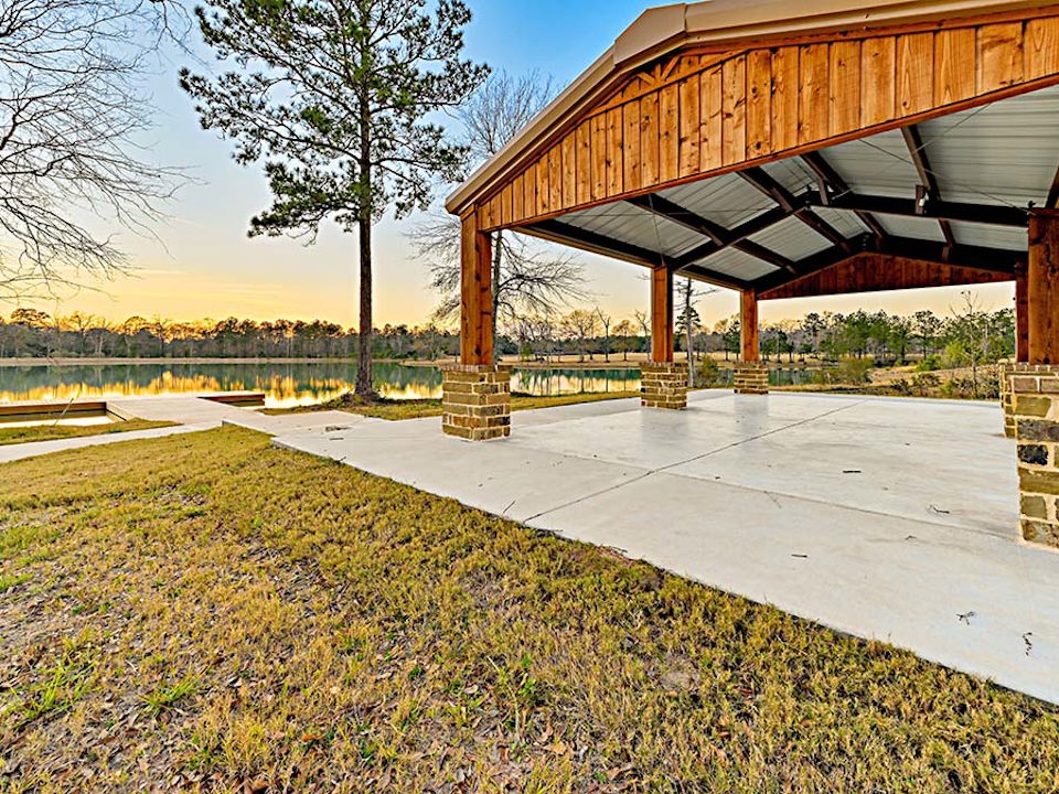 A wooden bridge over a pond.