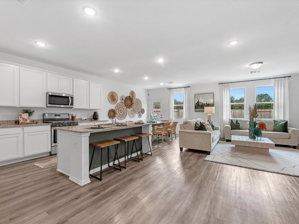 A large kitchen with white cabinets.